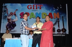 1st Topper in (MCA-5) Award to Pankaj Kumar Singh by Mr. Dineshanand Goswami with Mr. Om Prakash, Director GIIT
